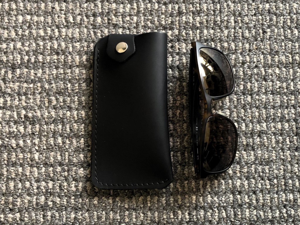 Leather glasses case with sunglasses